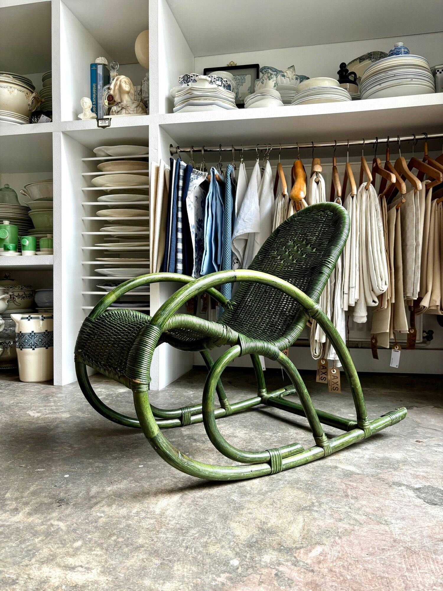 Children's rocking chair in woven wicker and green rattan