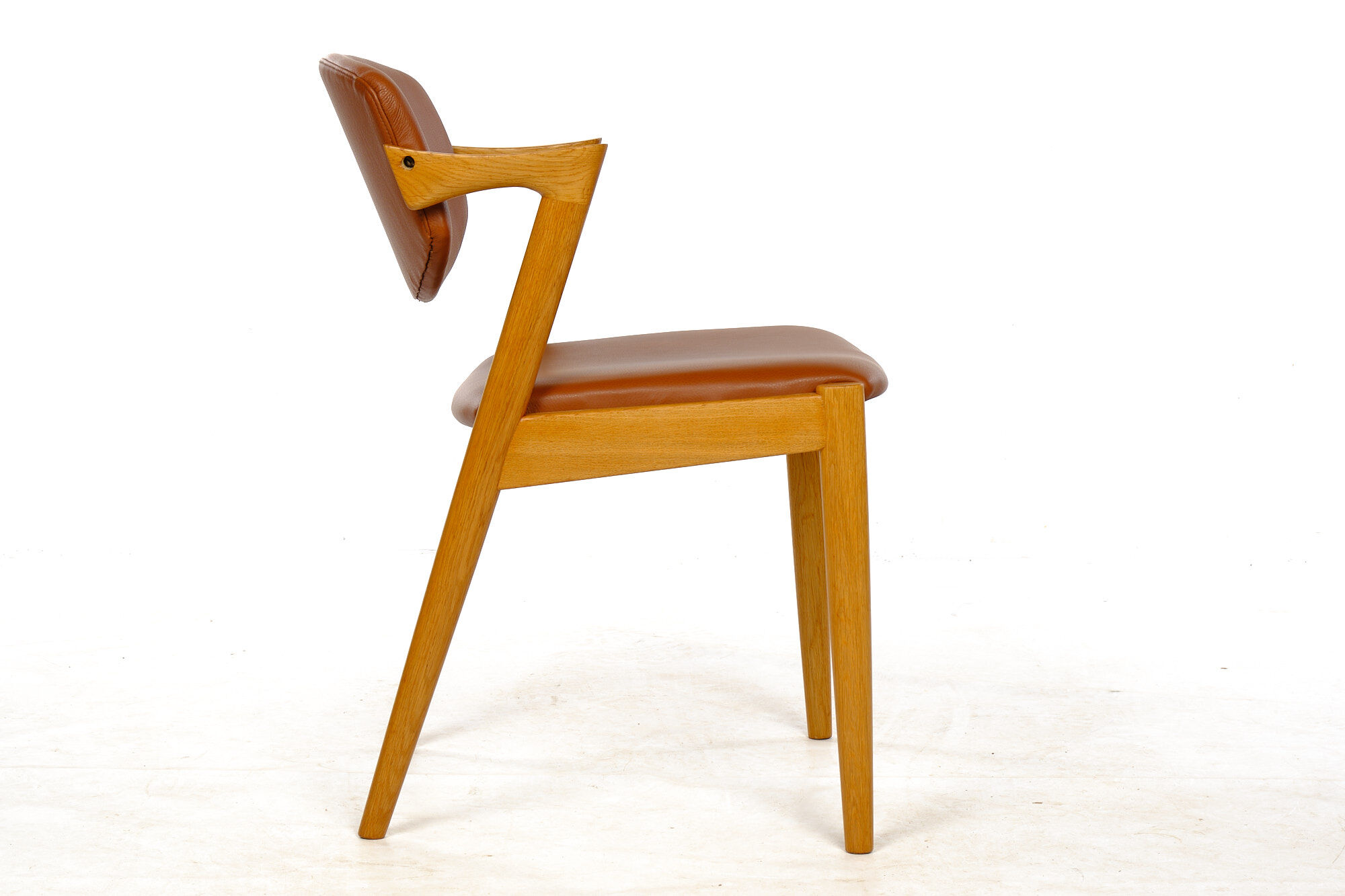 Four Kai Kristiansen oak chairs with new leather upholstery