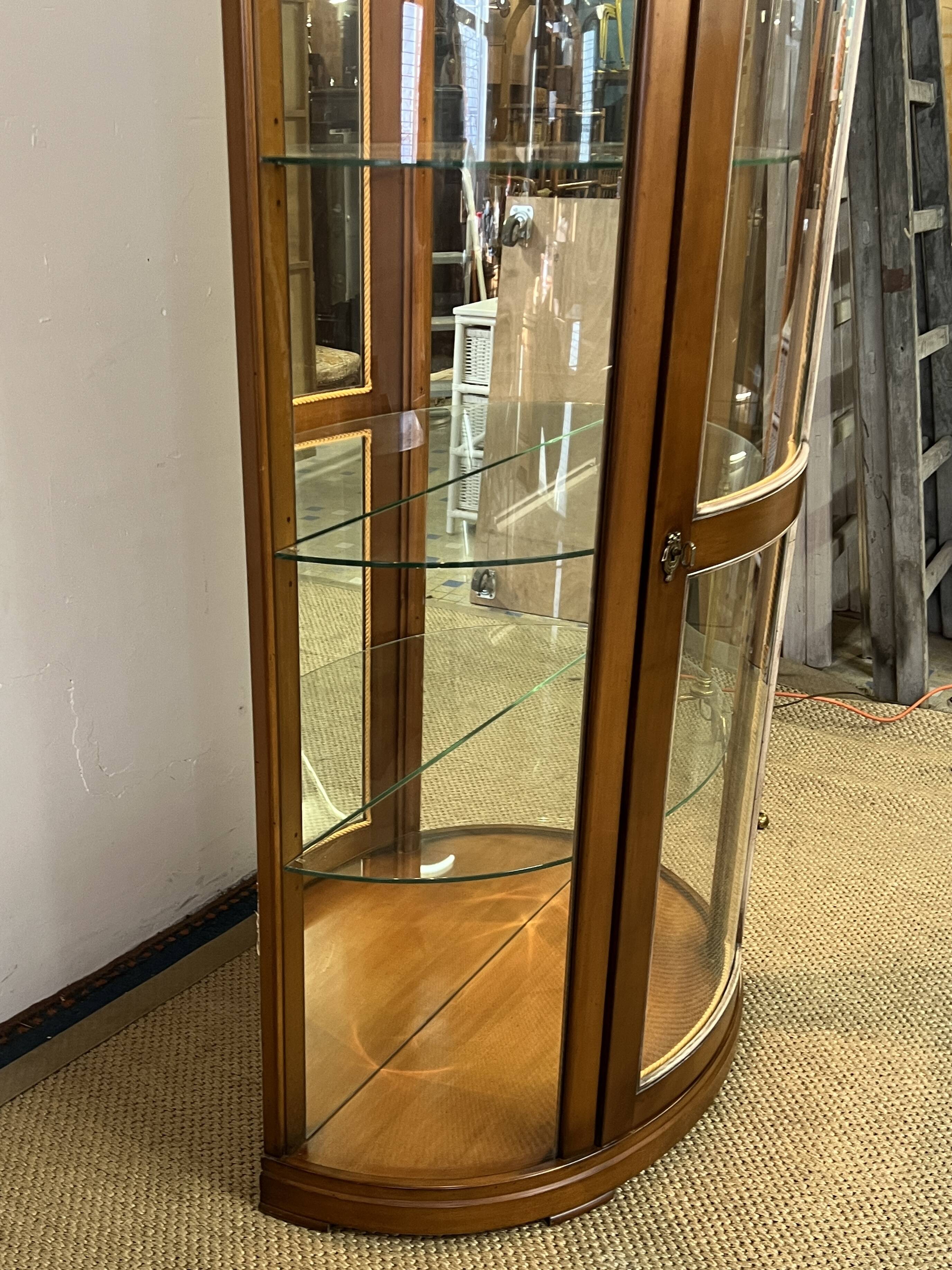Wooden display case and half-moon mirror