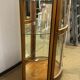 Wooden display case and half-moon mirror