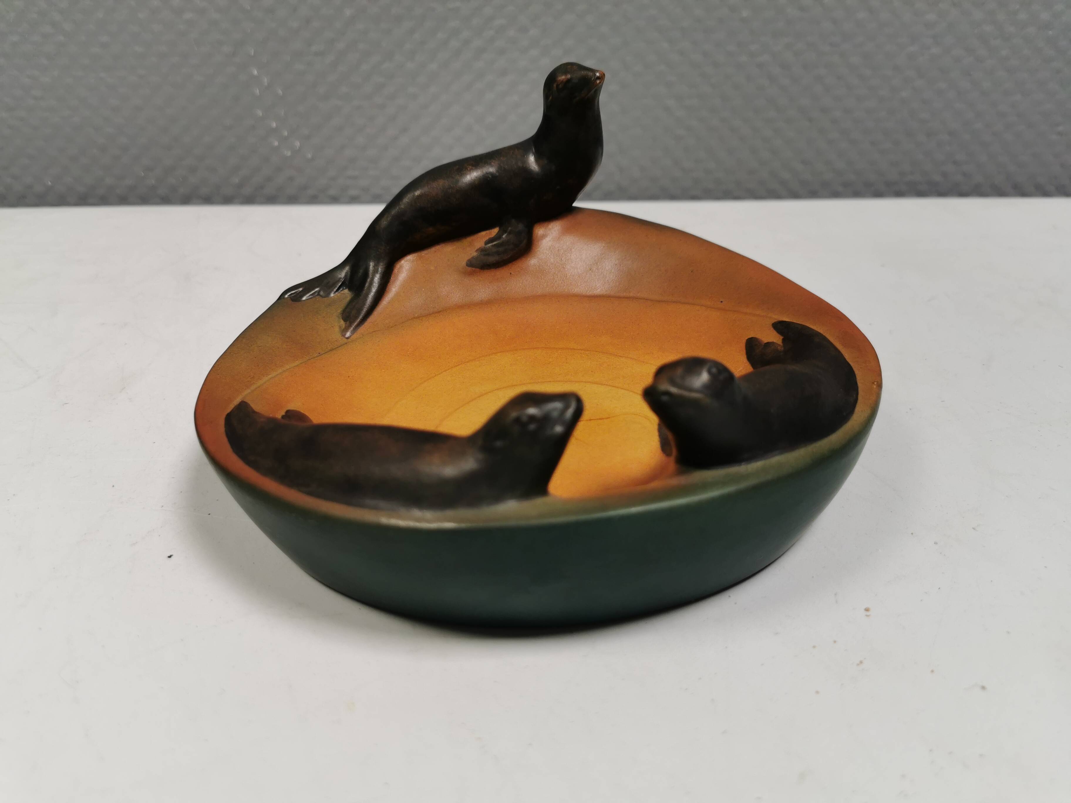 Dish with sea lions hand painted by Ipsen's widow, Denmark 1930s.