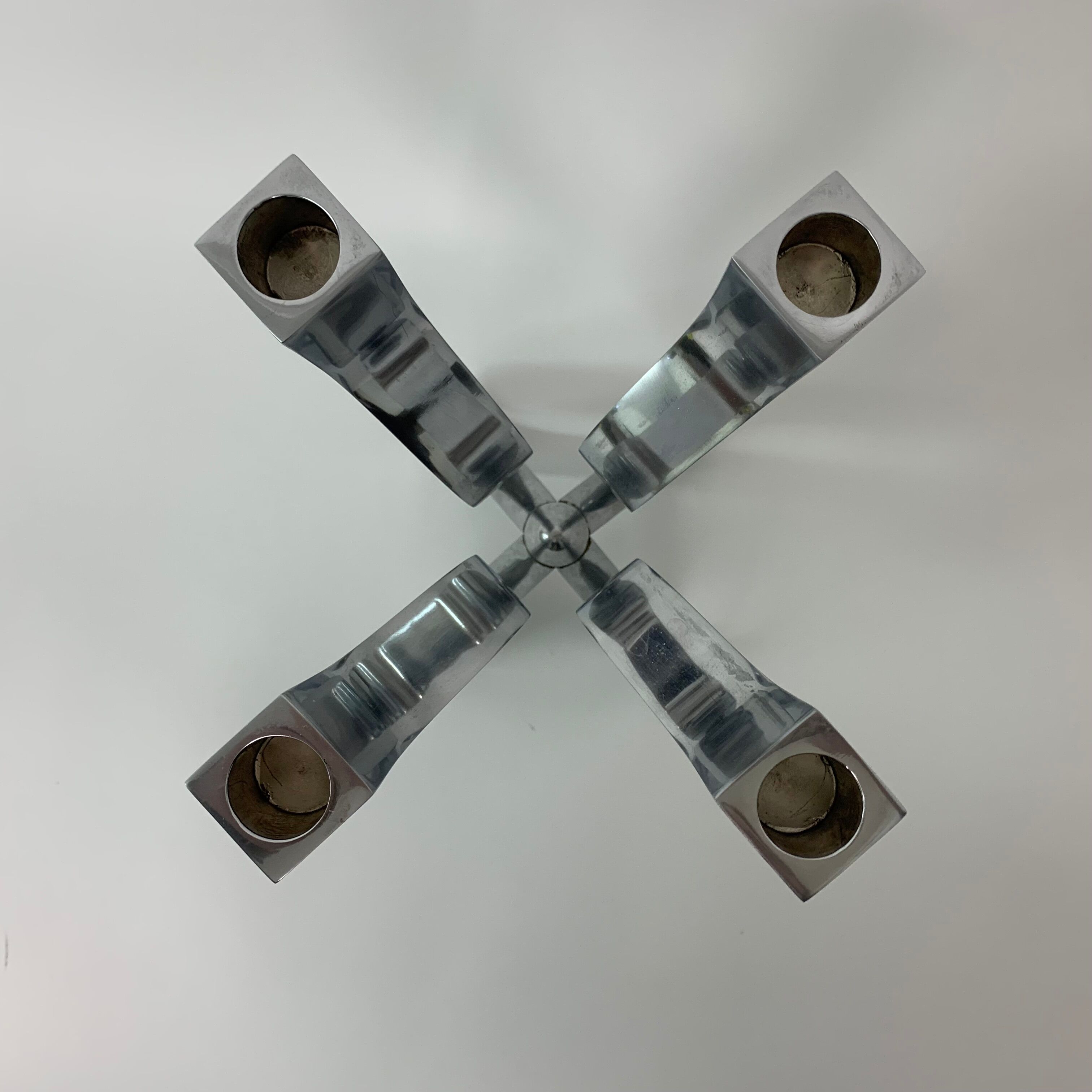 A chromed metal candle-holder "Chorus", design Karim Rashid, executed by Umbra / USA 2002