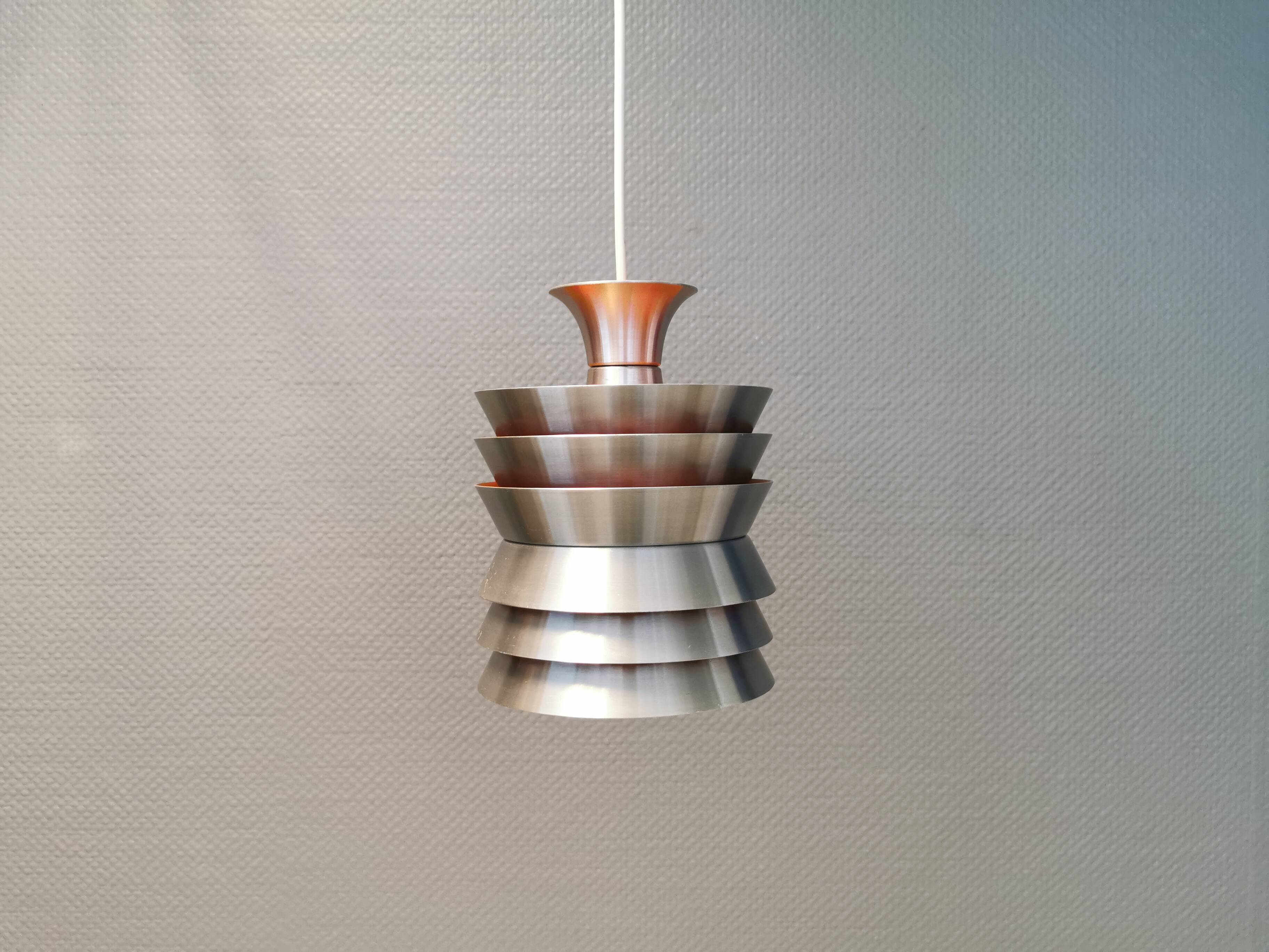 Danish/Swedish hanging lamp, in silver-coloured aluminium with orange interior paint.