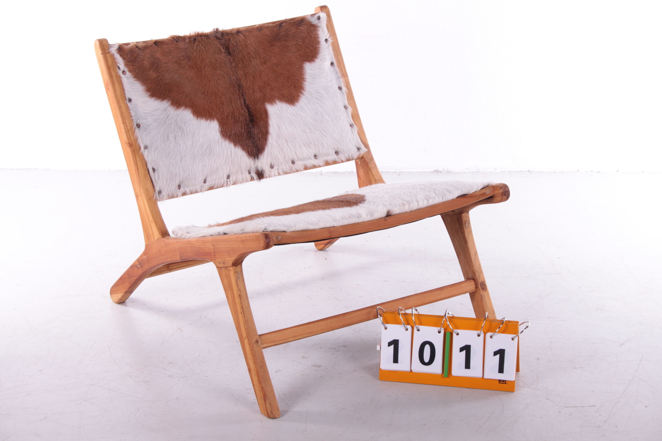 Vintage Relax chair upholstered with cowhide, 1970
