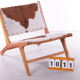 Vintage Relax chair upholstered with cowhide, 1970