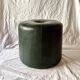 Pouf vintage rond en Skaï vert