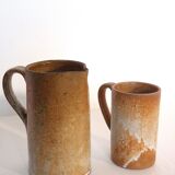 Decanter and enamelled stoneware mugs