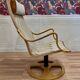 Swivel armchair and its ottoman in 1960s Scandinavian design.
