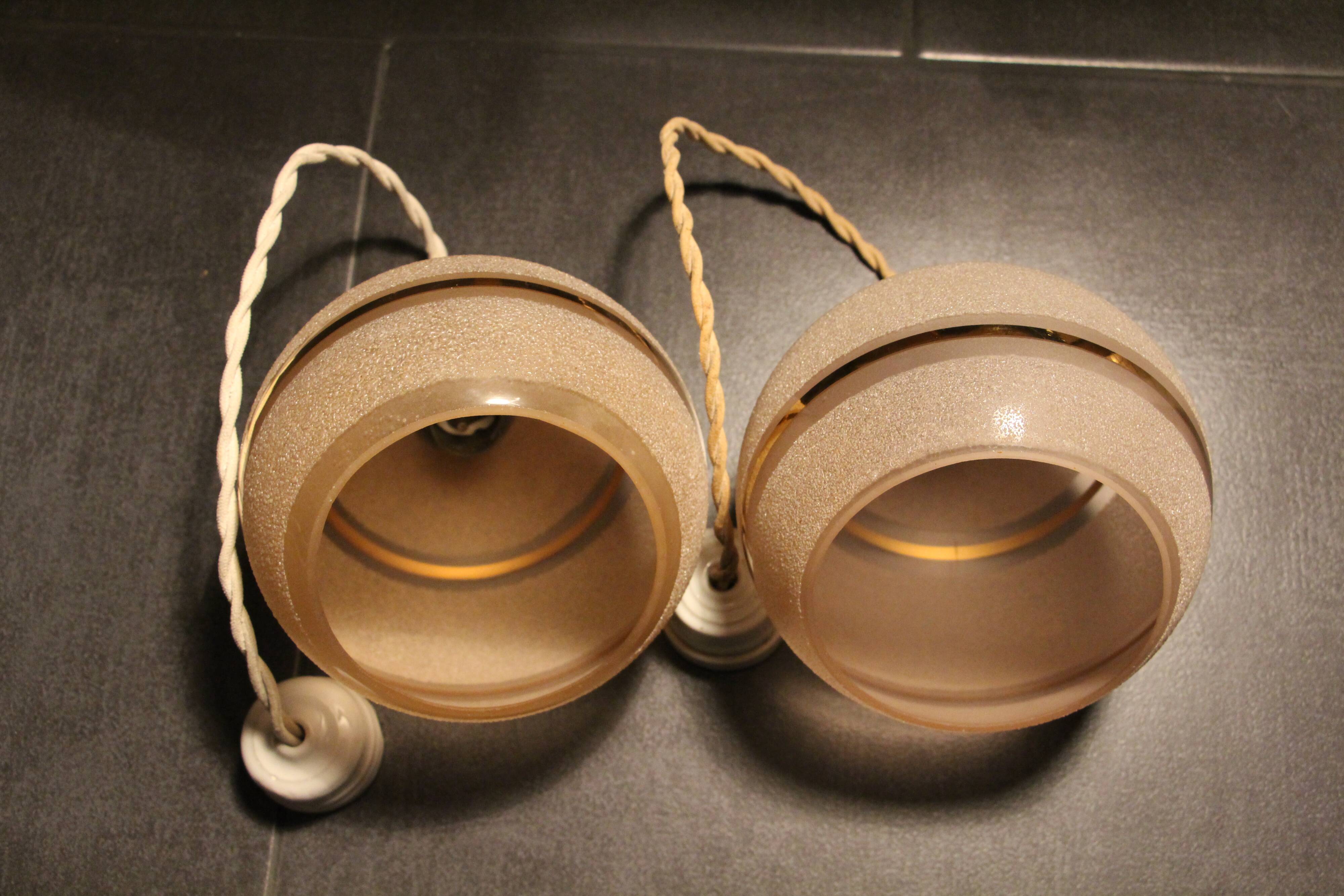 Set of two Art Deco pendant lamps in pink and gold glass