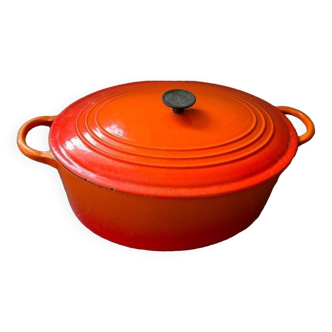 Le Creuset - Oval casserole dish in red/orange enameled cast iron