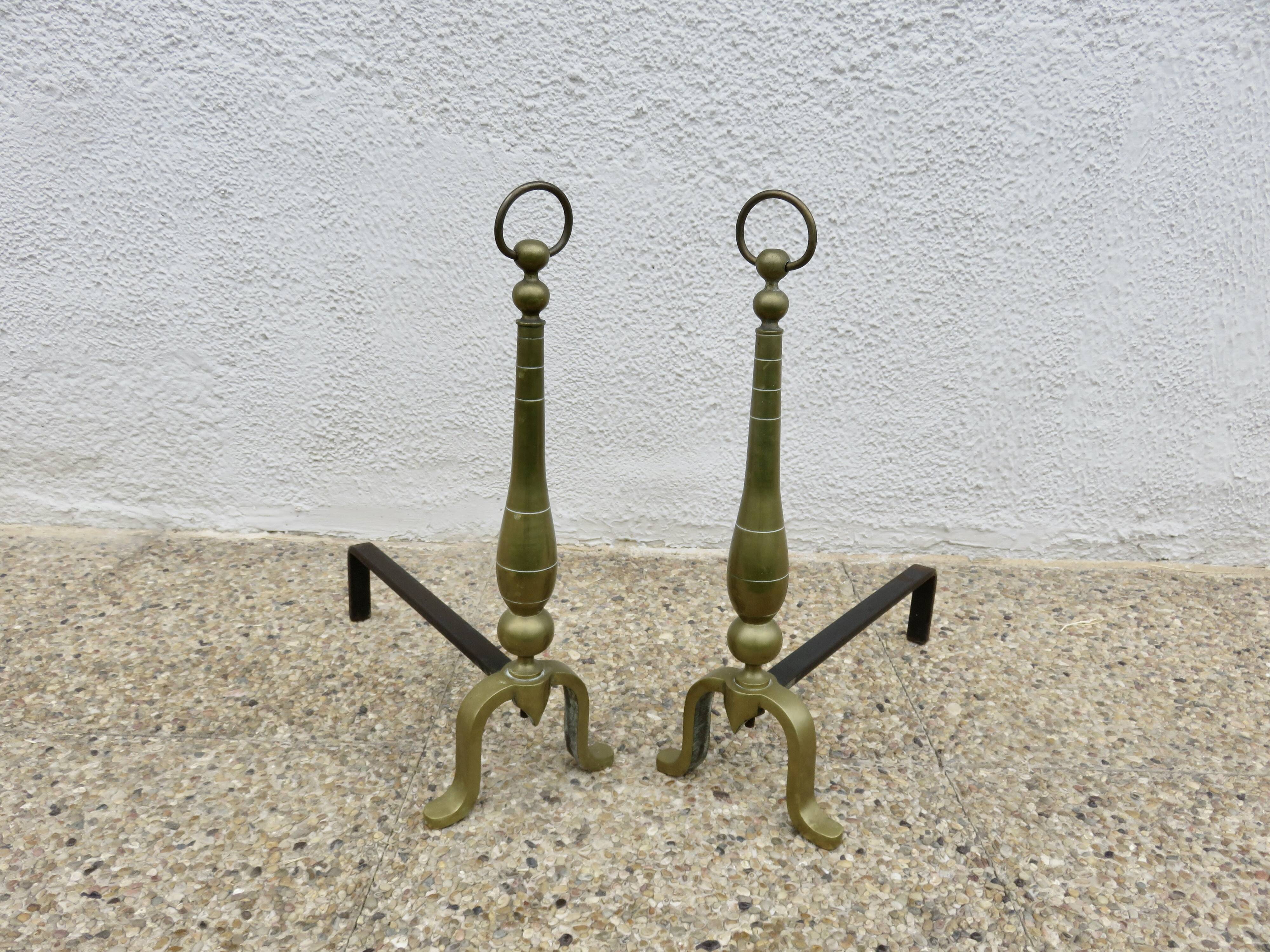 Pair of Neo-classical andirons, in solid bronze, 1920s-1930s.