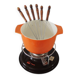 Nomar fondue service in orange cast iron
