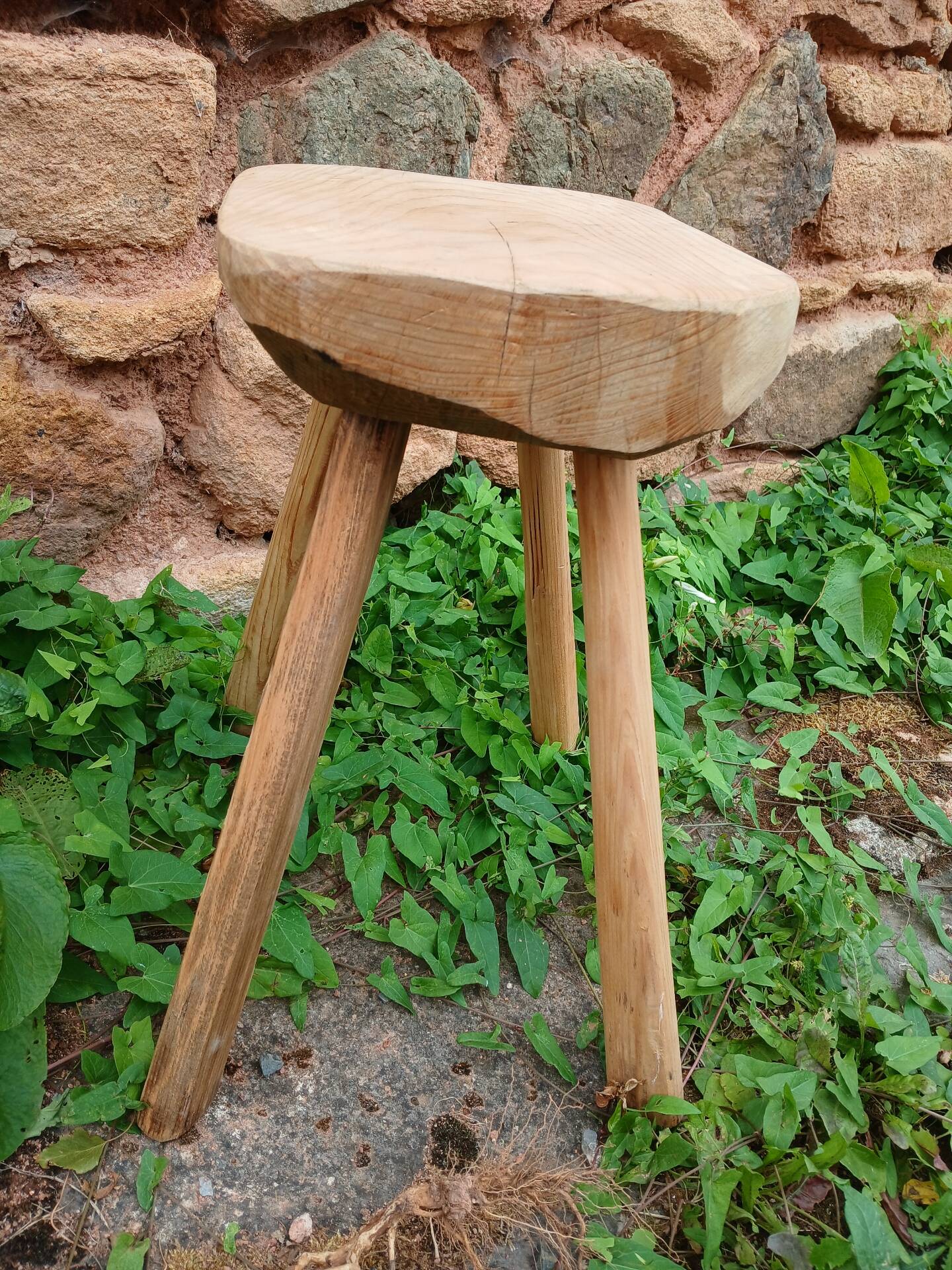 Antique stool in raw wood