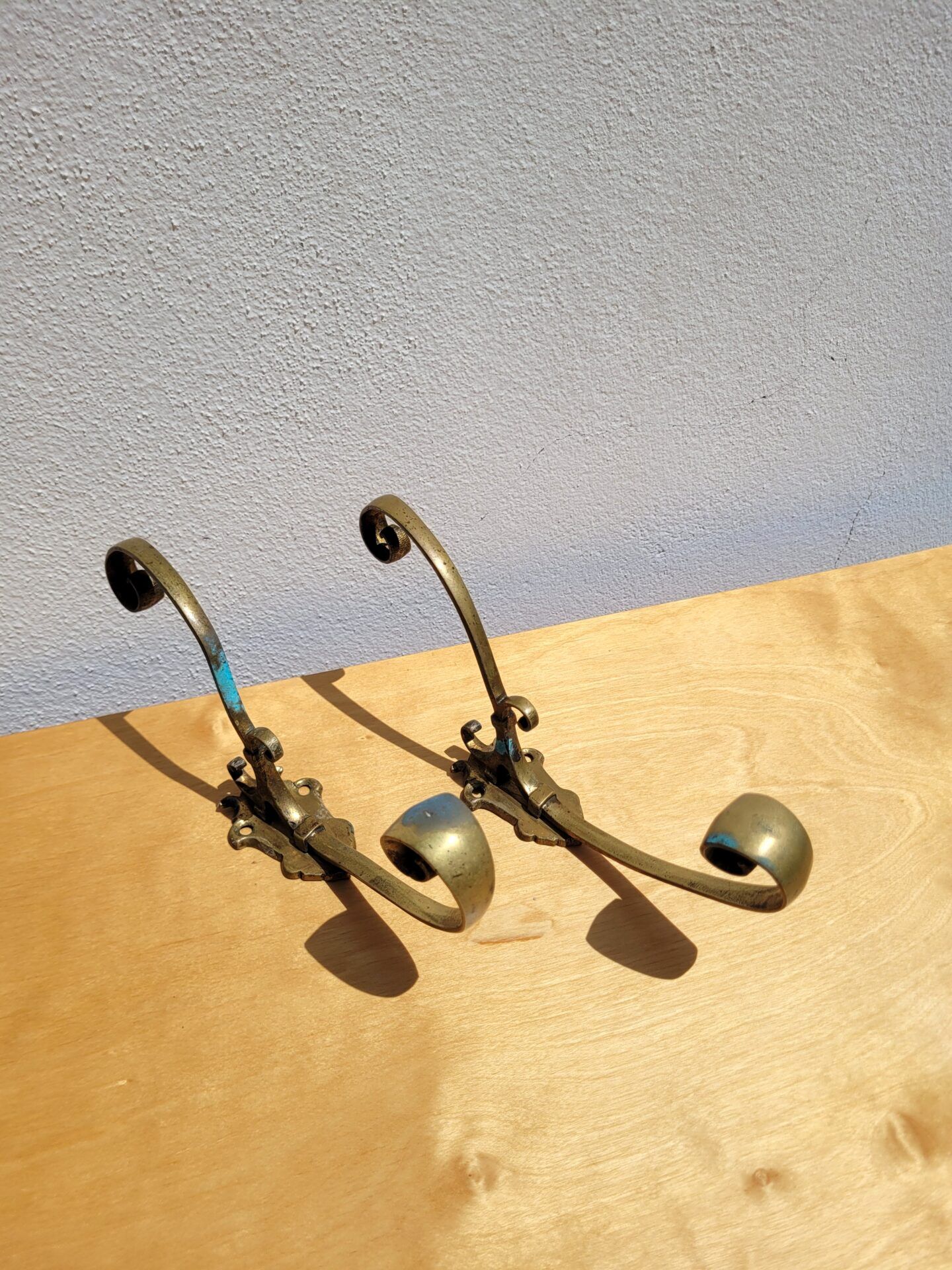 Pair of antique gilt bronze coat hooks