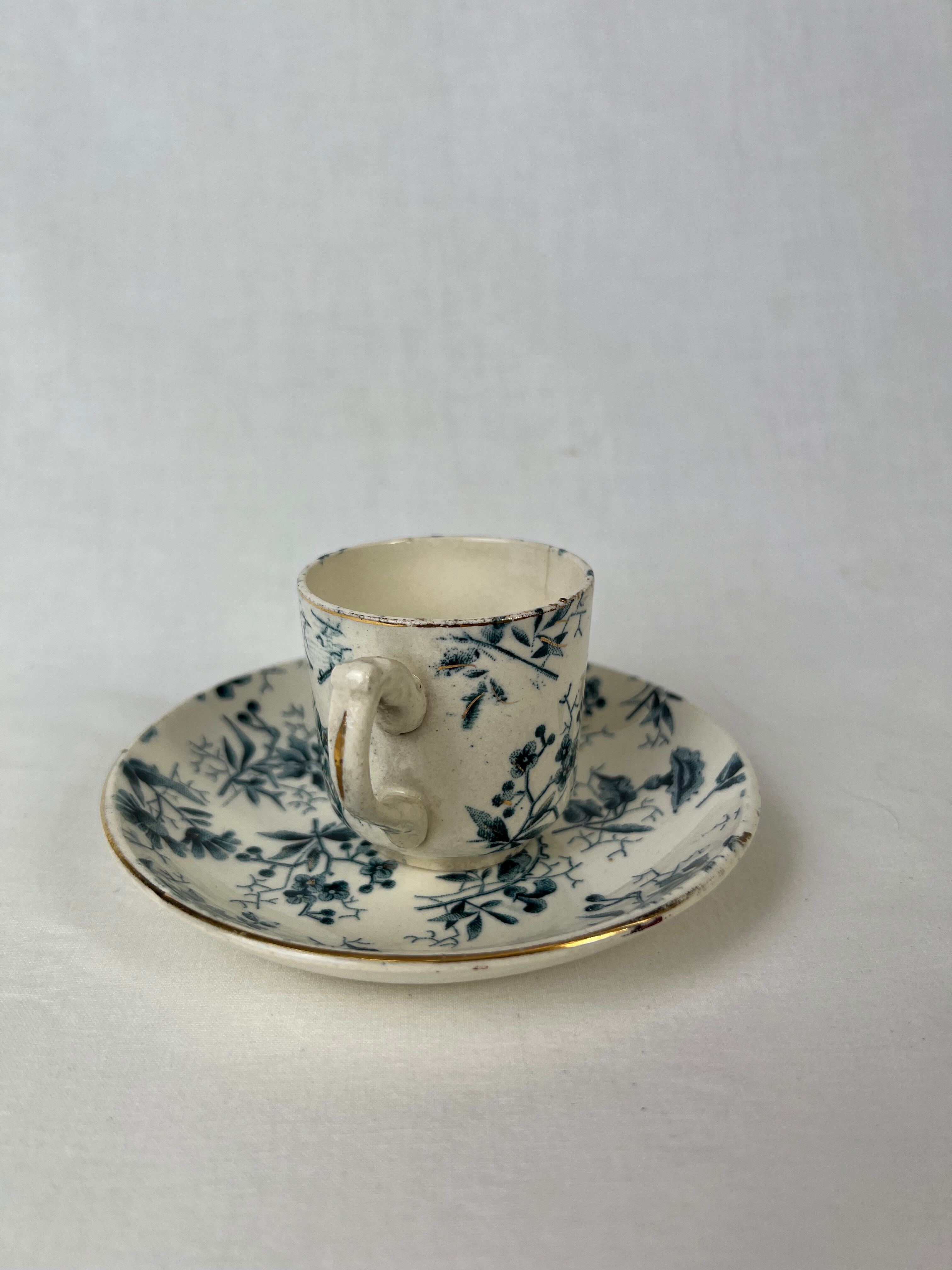 White porcelain cup with blue flowers