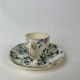 White porcelain cup with blue flowers