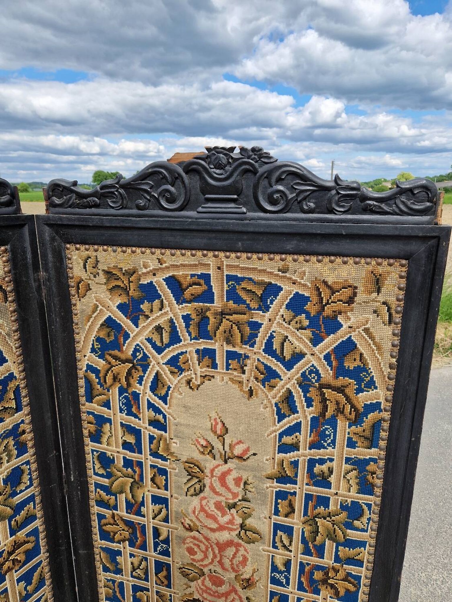 Folding screen in black-painted wood, 19th century
