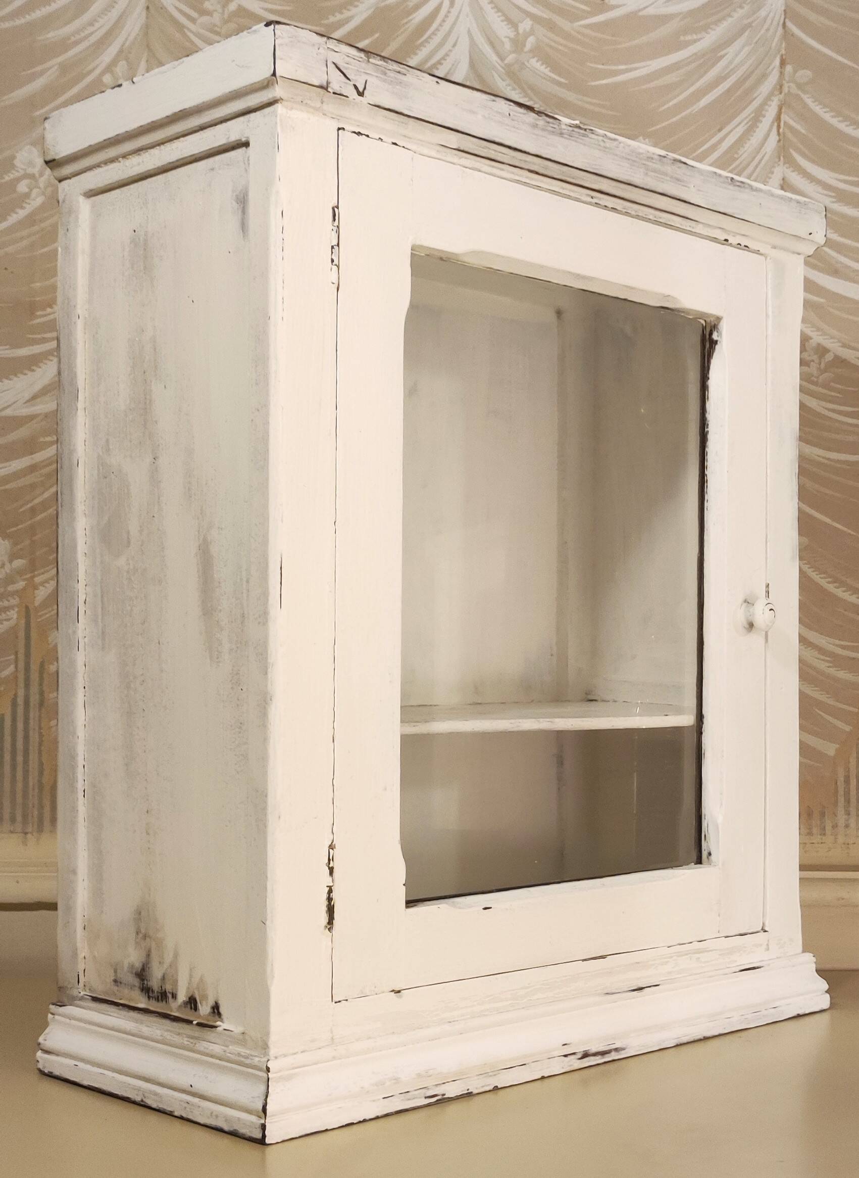 Glazed wall-mounted medicine cabinet in patinated wood