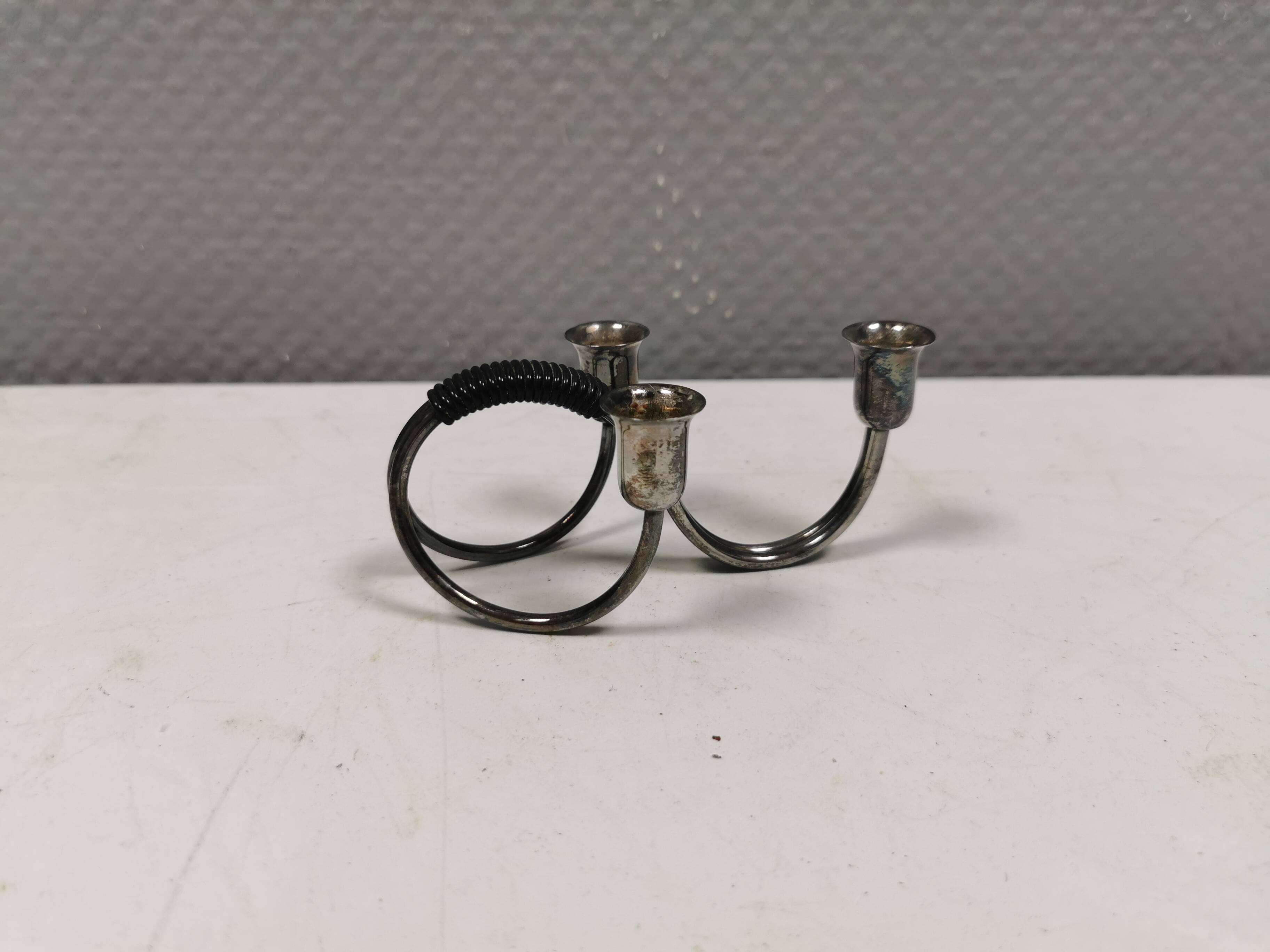 Small candle holder in tarnished silver, with place for three small candles