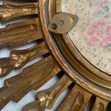 Sun mirror in old wood