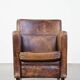 Dark brown design armchair made of sheepskin leather