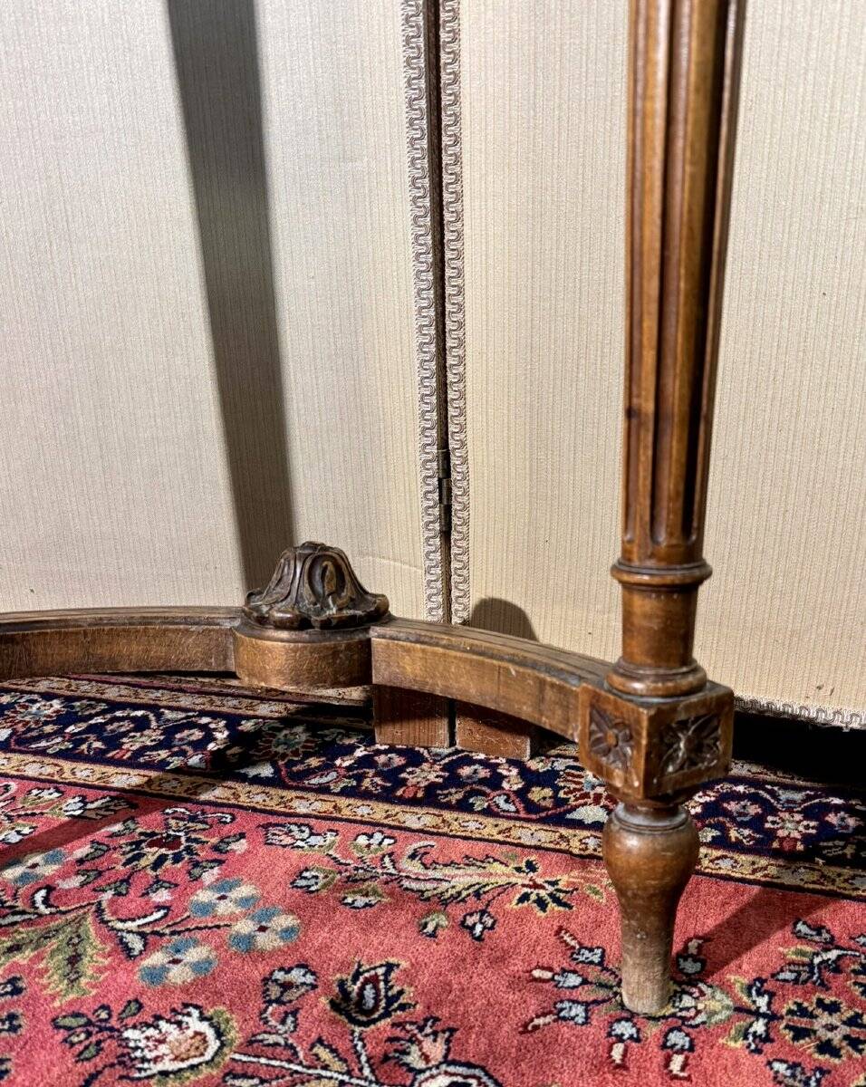 Half-moon console in Louis XVI style made of carved wood.