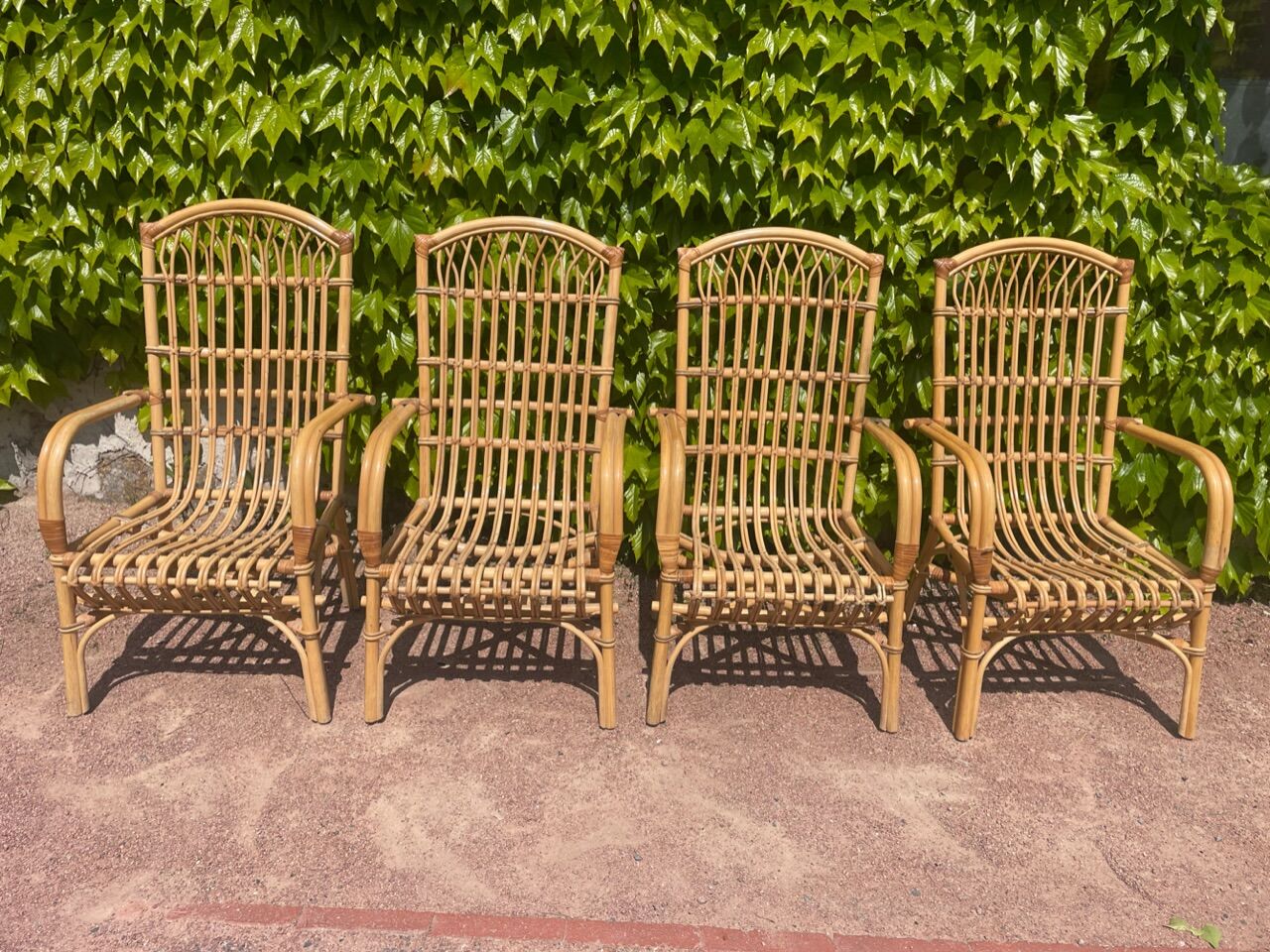 Series of 4 rattan armchairs from the 70s from the Netherlands
