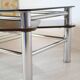Chrome metal coffee table with smoked glass top.