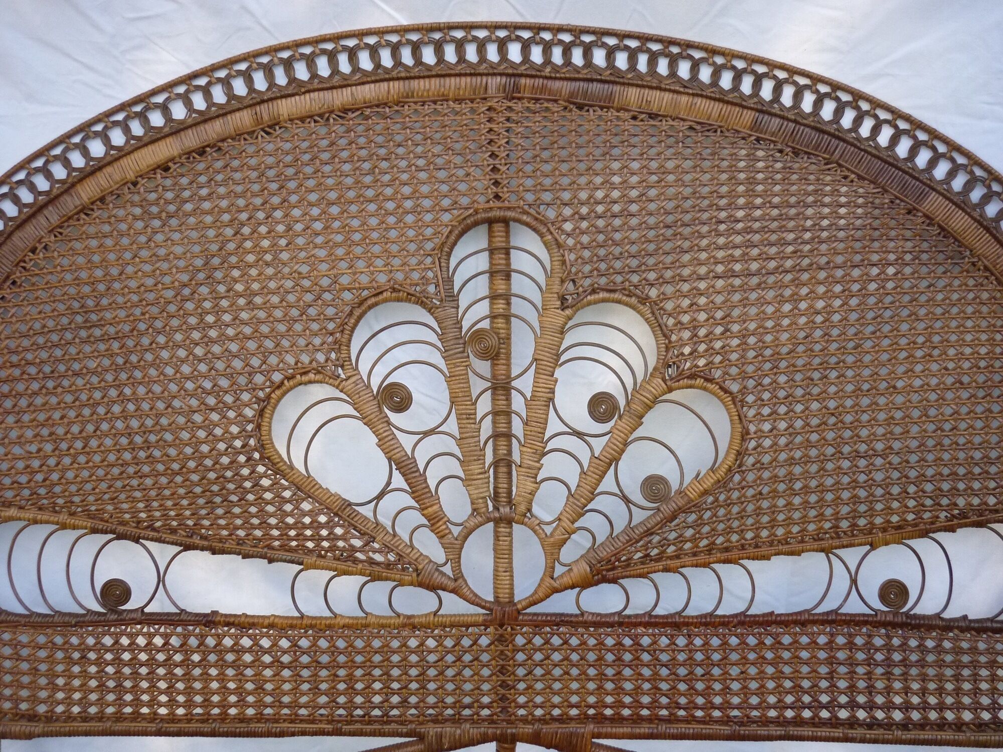 Braided and caning head of bed in wicker and rattan peacock