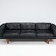 Illum Wikkelso model V11 sofa in black leather by Holger Christiansen, Denmark, 1960