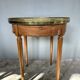 Hot water bottle table with a marble top and a brass gallery.
