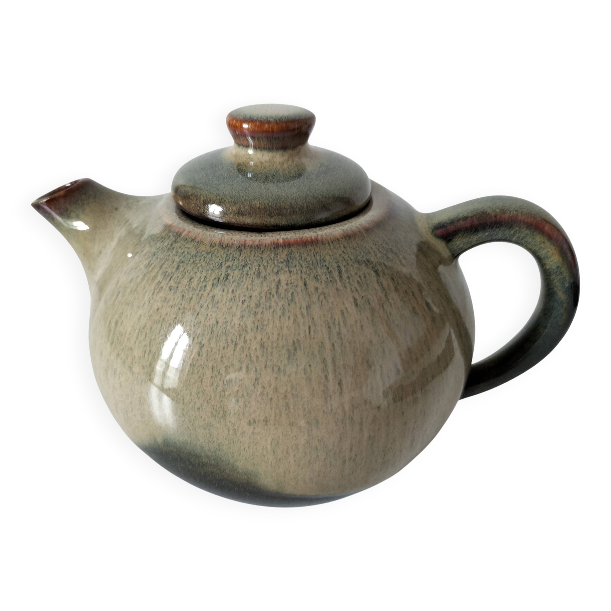 Vintage ceramic teapot with a flame design.