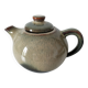 Vintage ceramic teapot with a flame design.