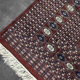 Handwoven red Boukhara oriental rug, 1960s