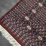 Handwoven red Boukhara oriental rug, 1960s