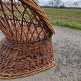 Old throne basket armchair in woven wicker