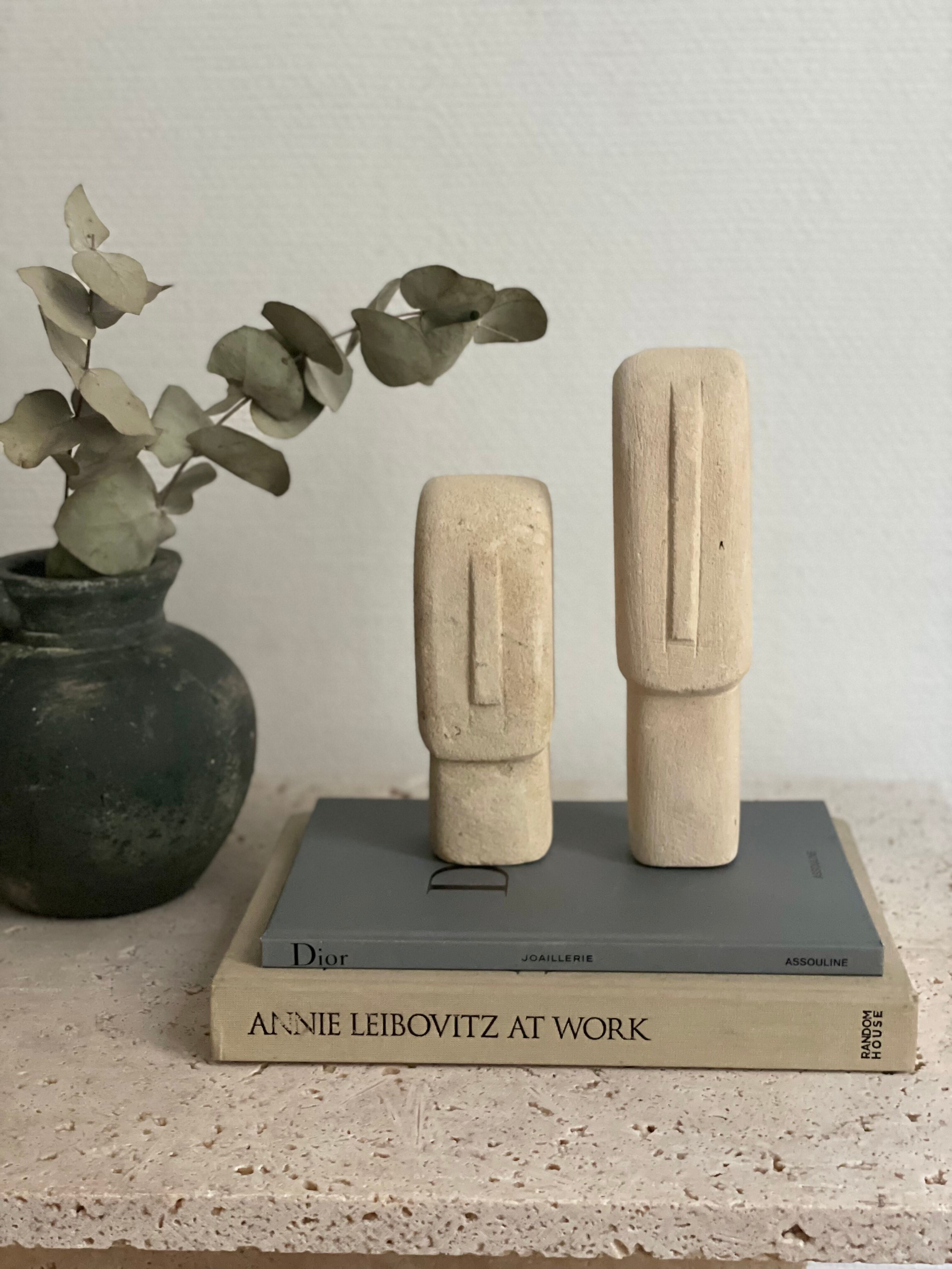 Set of two minimalist stone face statues