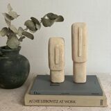 Set of two minimalist stone face statues