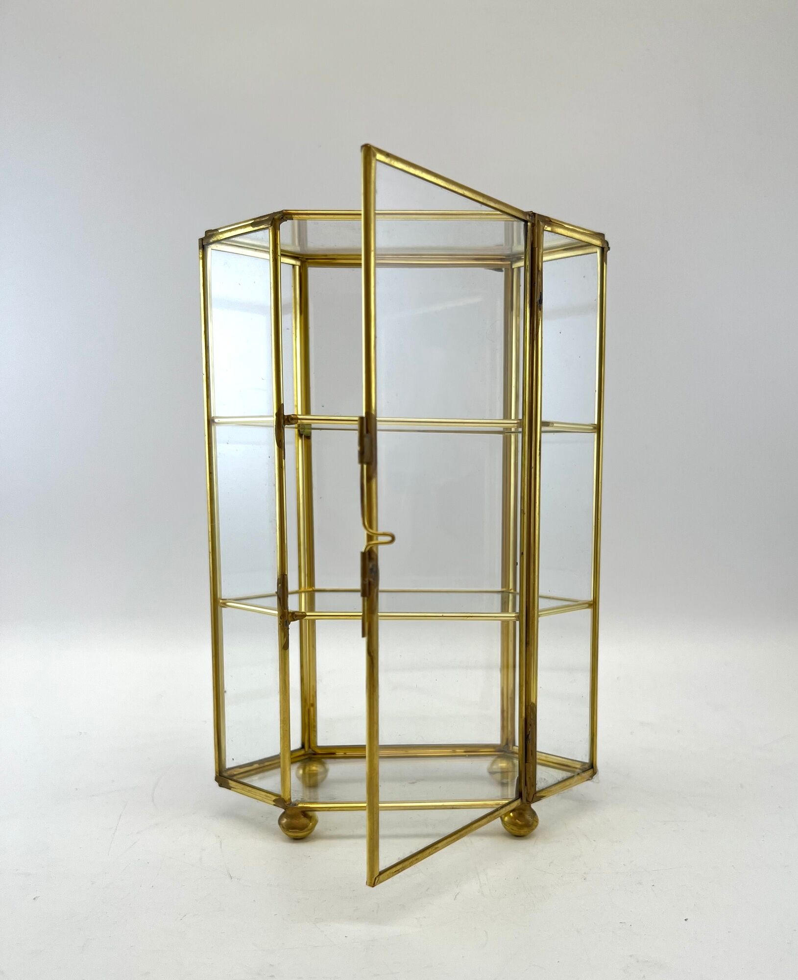 Glass and brass jewelry showcase