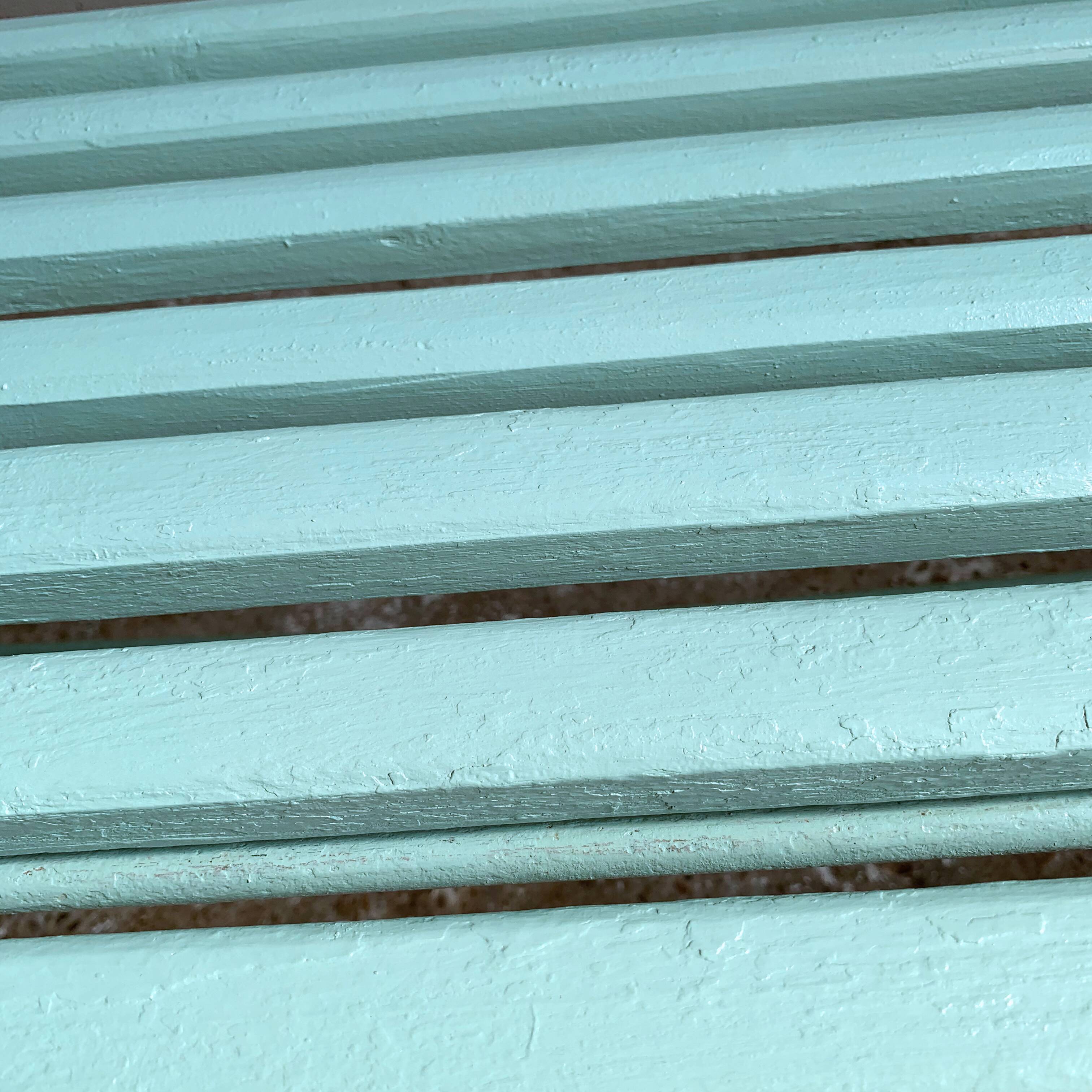 Former folding garden bench with wooden and metal slats