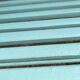 Former folding garden bench with wooden and metal slats