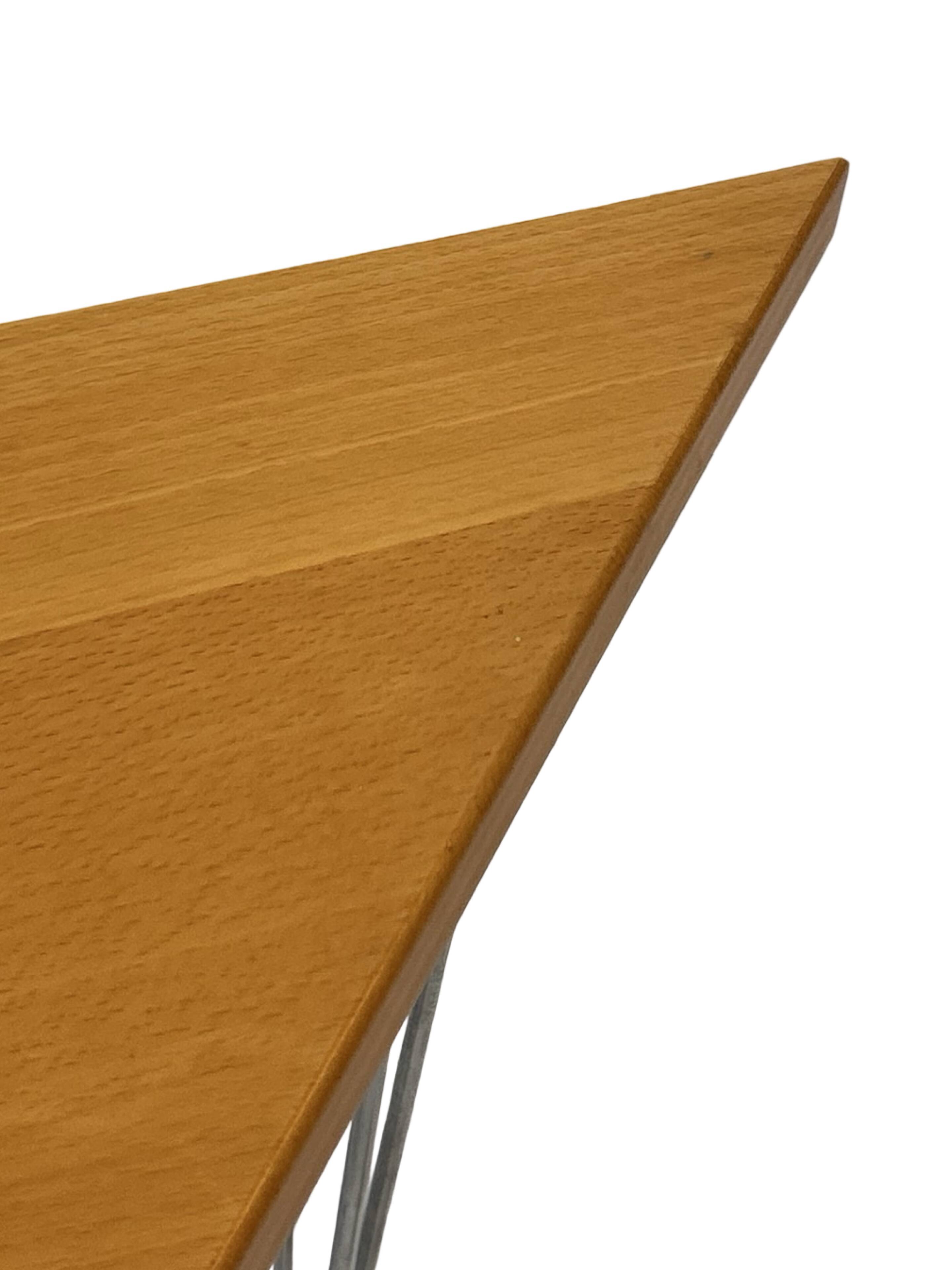 Vintage Danish triangular side table with hairpin legs design