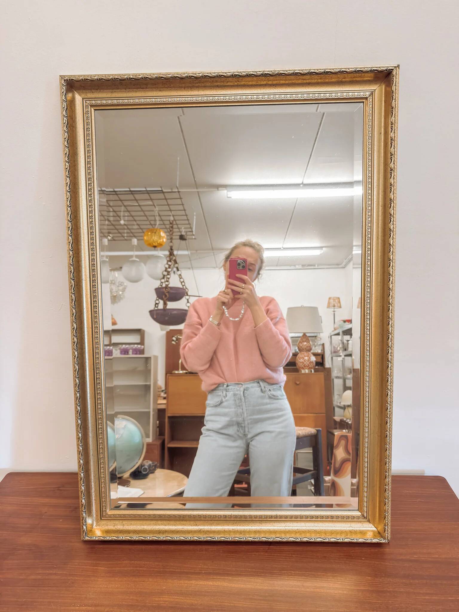 XL vintage bevelled mirror with a gold frame.