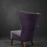 High-backed wing chair in oak and purple fabric, vintage Scandinavian style from the 1950s.