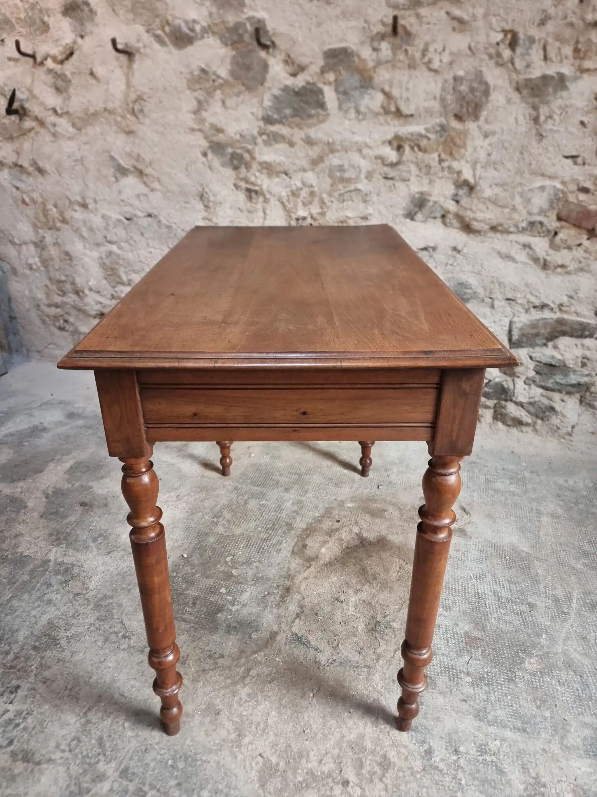Antique French writing table in walnut with a drawer, circa 1900.