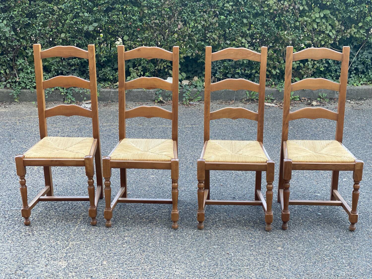 4 straw and solid wood chairs with high backs