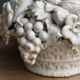 Ornamental basket decorated with trompe l'oeil fruits