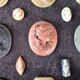 Collection of cameos and intaglios, shells and lava stones, around 1900.