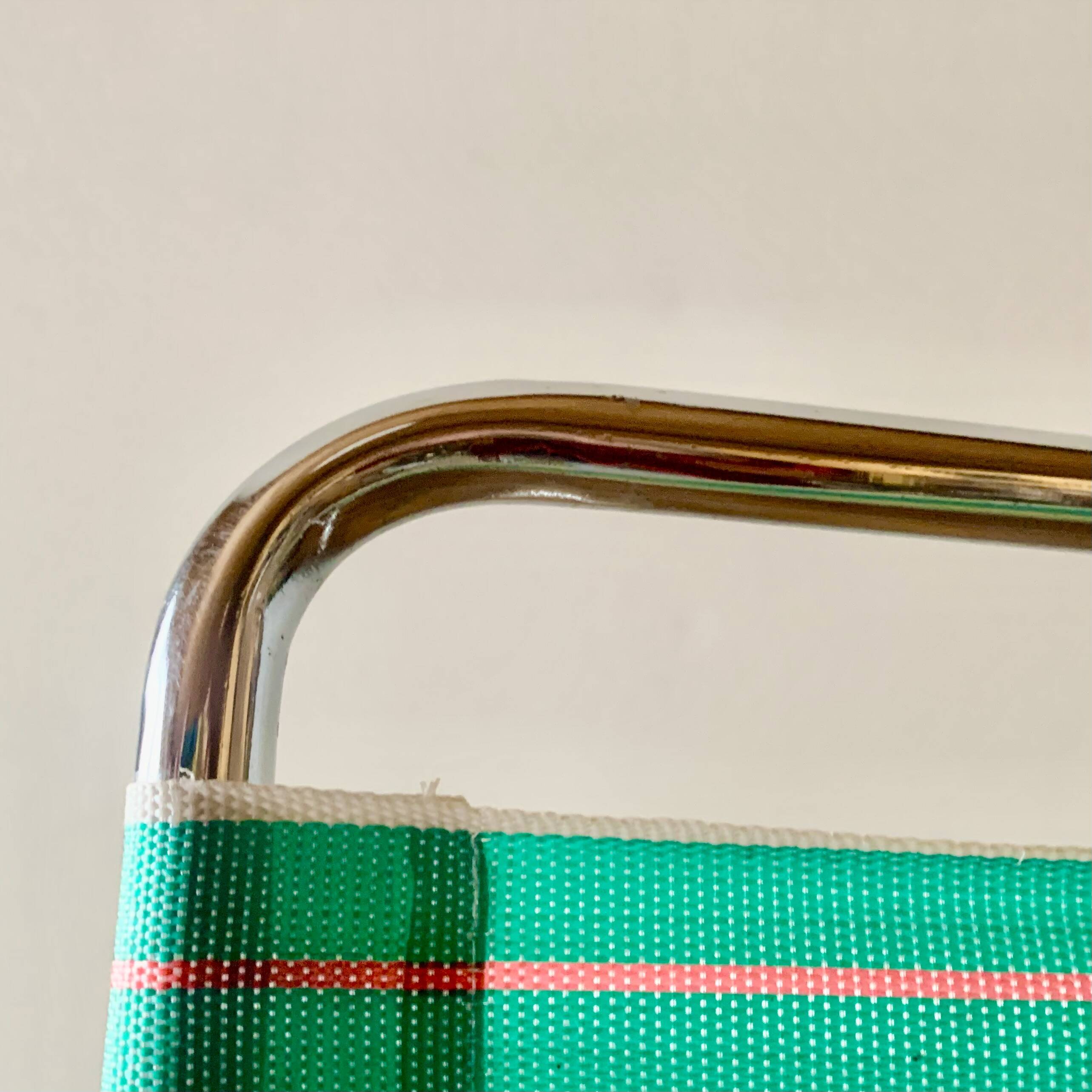 Vintage folding beach chair in chrome metal and woven plastic