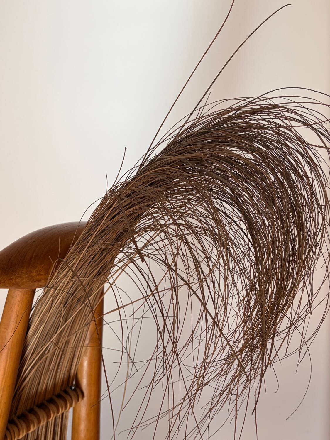 Pair of sculptural chairs in teak and rattan, Bali, 1990s